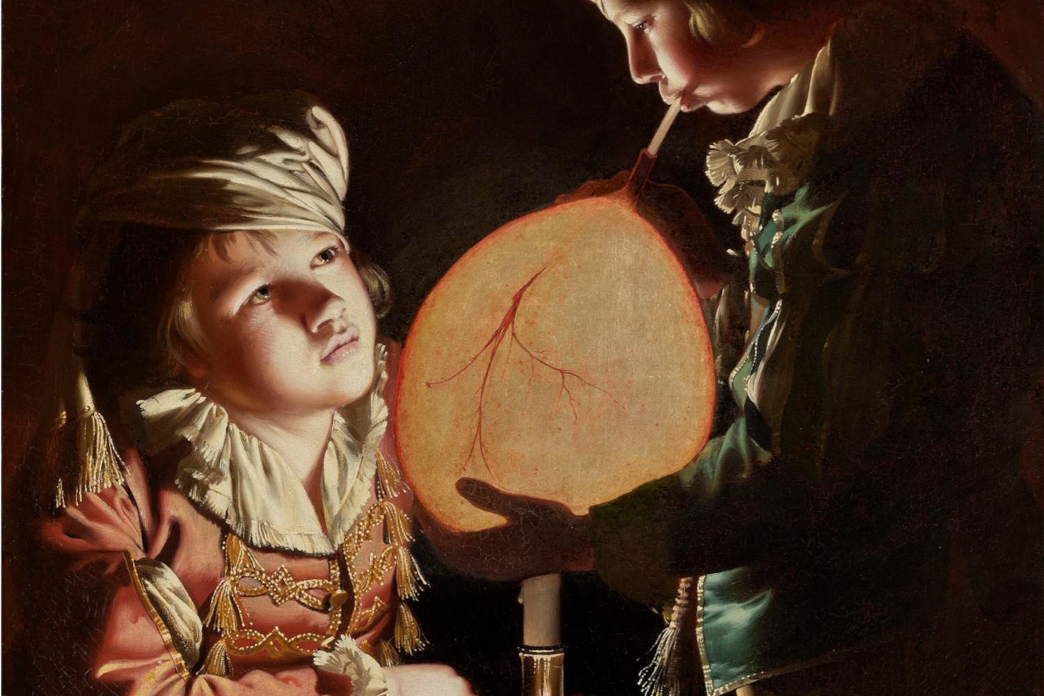 Effect of light diffusion and transmission through tissues was observed long time ago. E.g. in “Two Boys with a Bladder”, by Joseph Wright of Derby (England, 1734 - 1797) the white candle light clearly enhances tissue features, like vessels.